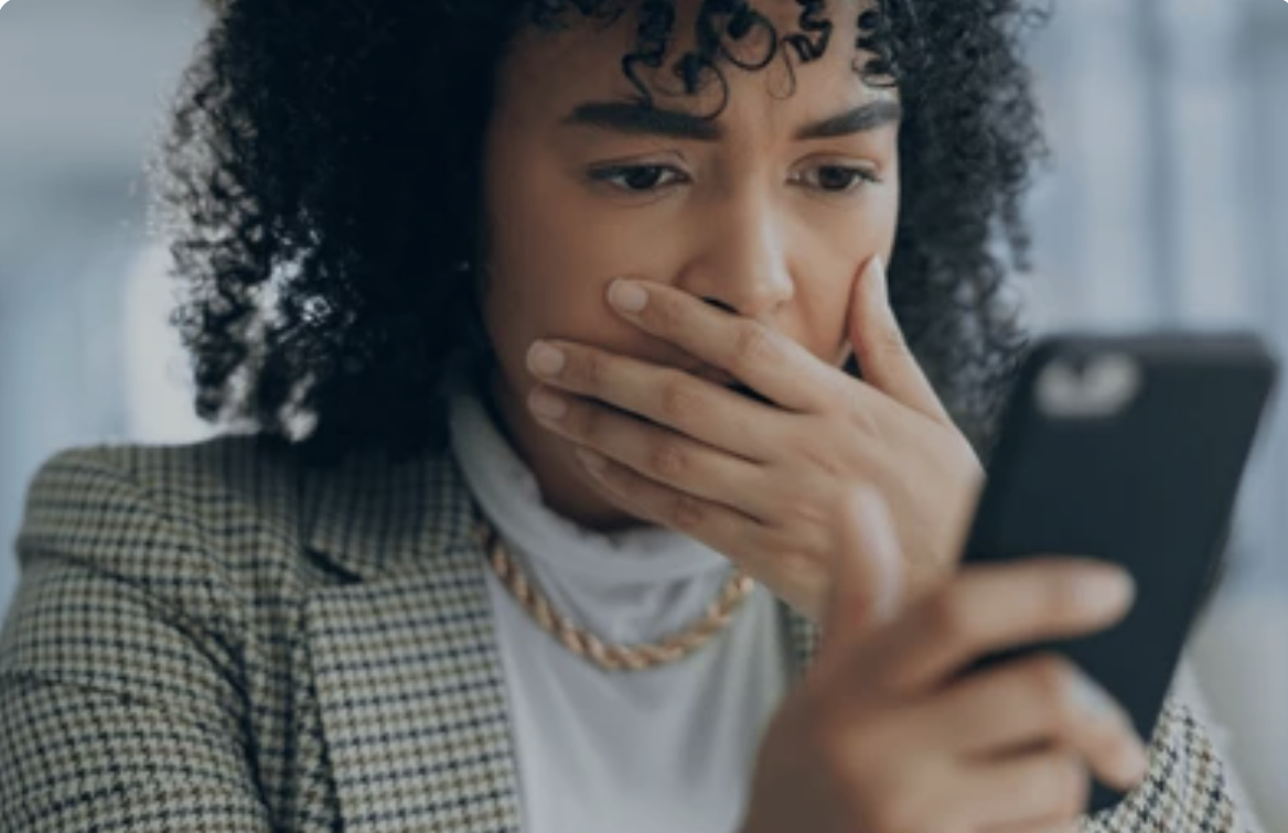 worried girl looking at her phone.